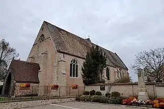 Façade ouest et son porche-caquetoire, mur sud.