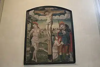 Tableau XVIe siècle représentant saint Sébastien et saint Roch entourant le Christ crucifié.