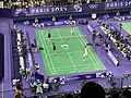 Échauffement d'un double mixte pendant la compétition.