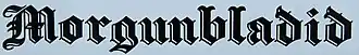 Titre de presse en lettres gothiques noires.