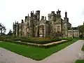 Le château de Margam, construit entre 1830 et 1835 par l'architecte Thomas Hopper&nbsp;(en) à Port Talbot, au Pays de Galles.