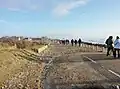 Penhors : la route littorale D 40 envahie par les galets et détruite par la mer à la suite de la tempête du 1er février 2014.