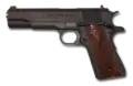 Sûreté de type bouton actionné par la paume sur la crosse d’un Colt 1911 (à l’arrière de la crosse).