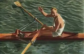 Un homme dans une embarcation saluant de sa main droite.