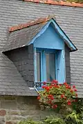 Lucarne à pignon couvert.