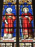 Église paroissiale Saint-Milliau : un vitrail (saint Étienne et saint Laurent).