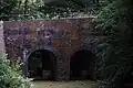 Pont issu des aménagements hydrauliques du parc de l'abbaye.