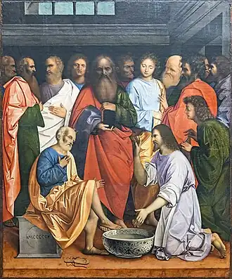 Image d'une peinture représentant dans une pièce, les apôtres debout à l'arrière-plan, leurs têtes alignées à la même hauteur, à l'exception de Pierre, assis au premier plan avec au centre une grande bassine, à droite Jésus et un aide tenant une serviette.