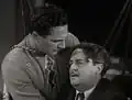 Avec Tom Tyler (à g.), dans Le Capitaine Marvel (1941)
