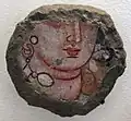 Fragment d'une tête féminine. Peinture murale, grotte G Bamiyan. VIe&nbsp;siècle-VIIe&nbsp;siècle. Musée Guimet