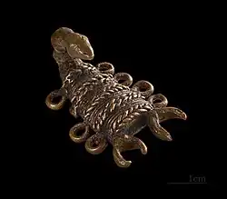 Poids ashanti traditionnel à peser l'or, laiton à la cire perdue. XIXe siècle. Muséum de Toulouse.