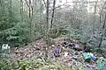Ancienne carrière de Mallety, envahie par des déchets.