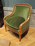 Galette de fauteuil recouverte de velours sur un fauteuil légèrement rembourré, clous dissimulés par un galon, États-Unis, vers 1890.