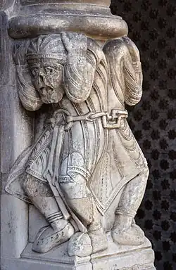 Les atlantes enchaînés de la cathédrale Sainte-Marie d'Oloron.