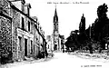 Augan ː la rue principale vers 1930 (carte postale).