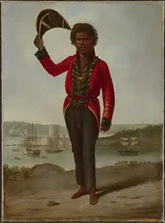 Portrait of Bungaree, a native of New South Wales, with Fort Macquarie, Sydney Harbour, in background, 1826, huile sur toile, 68.5 x 50,5&nbsp;cm, National Library of Australia