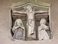 Petit calvaire sur la façade d'une maison.