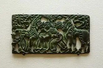 Plaque de bronze représentant des hommes avec leurs chevaux, IIe&nbsp;siècle&nbsp;av. J.-C., Musée ethnologique de Berlin.