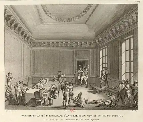 Robespierre, blessé à la mâchoire, est étendu sur une table dans l'anti-salle du Comité de salut public, le 10 thermidor an II (28 juillet 1794). Estampe, Paris, BnF, 1802.