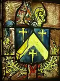 Blason de l'évêque Ferdinand de Neufville de Villeroy, au Centre International du Vitrail de Chartres : d'azur au chevron d'or, accompagné de trois croix pattées au pied fiché. Cimier : une crosse d'or accolée à une mitre au naturel. Soutien : deux palmes de sinople (effacé) reliées par un ruban de gueules.