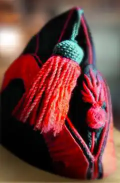 Bonnet de police de sapeur pompier à gland rouge, début XIXe siècle.
