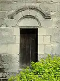 Croisillon, porte romane.