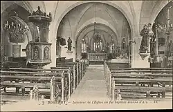 Carte postale, entre 1880 et 1945, représentant l'intérieur de l'église où fut baptisée Jeanne d'Arc.