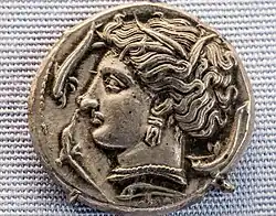 Visage de Tanit sur une piece de monnaie cathagénoise (350 avant.J.C)