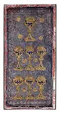 Le sept de coupe d'un tarot Visconti-Sforza ; le sept de cœur dériverait de ce type de carte.