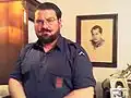 Homme portant l'uniforme phalangiste.