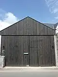 Entrée du chantier (hangar), sur la rue Jean Jaurès