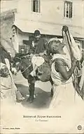 Charmeur de serpent au Maroc vers 1919.