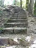Escalier du Pas de l'Échelle, en 2012.La plate-forme de la voie, située à droite de cet escalier de 100 marches construit en 1893, est encore visible.