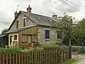 Cité du Coq rouge : une des maisons (avec de nombreux ajouts).