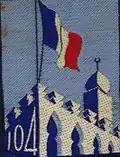 Insigne du CJF 104 (1er&nbsp;modèle avec numéro).