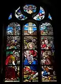 L'église Saint-Pierre, vitrail du transept sud : l'Adoration des mages.