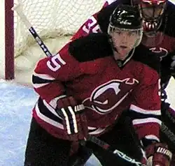 Photographie de White avec le maillot rouge des Devils du New Jersey