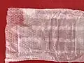 Tissu non tissé en contact avec le bébé, traces de colle (bandes)