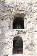 Grotte no&nbsp;19 : dans l'ombre, le regard de Bouddha.