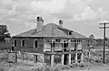Vue d'une maison abandonnée de la plantation en 1938