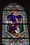 Vitrail représentatif des vitraux du XIXe s. de l'église : baptême de Clovis.