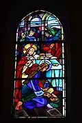 Vitrail des « Métiers d'Art » de 1945 : Marie-Madeleine lavant les pieds de Jésus.