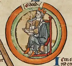 Une miniature représentant le roi assis et couronné, une main pointée vers la gauche et l'autre tenant un sceptre
