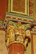 Saint homme à nimbe cruciforme présentant le plan de l'église.