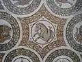 Détail de la mosaïque représentant des protomés d'animaux d'amphithéâtre.