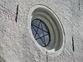 Dans une lucarne de l' Église d'Eljaröd (années 1200) à Tomelilla, Scanie, diocèse de Lund en Suède.