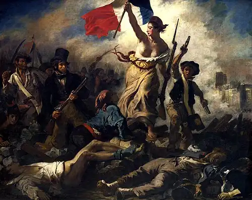 une femme brandit un drapeau tricolore sur les barricades