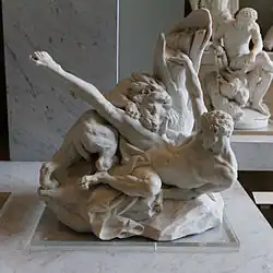 statue de marbre d'un homme dévoré par un lion