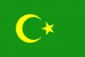 Drapeau vert avec un croissant et une étoile jaunes.