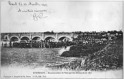 Reconstruction du pont sous la surveillance de l'armée prussienne.
